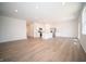 Bright living area with hardwood floors that leads to kitchen with an open concept at 5145 Cartland Dr, Indianapolis, IN 46239