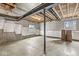 Unfinished basement showcasing exposed ceiling beams, support beams, and concrete flooring, ready for customization at 5421 Landing Place Ln, Noblesville, IN 46062