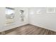 Bright, empty bedroom with wood floors, white walls and three sunny windows at 5421 Landing Place Ln, Noblesville, IN 46062