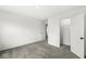 Bright, carpeted bedroom boasts doors to the en-suite and walk-in closet at 5421 Landing Place Ln, Noblesville, IN 46062