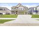Charming two-story home featuring a three-car garage and a well-maintained lawn at 5421 Landing Place Ln, Noblesville, IN 46062