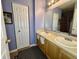 Functional bathroom featuring double sinks, and neutral accents at 5451 Kelvington Ln, Indianapolis, IN 46254