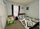 Well-lit bedroom with neutral carpet and bed with patterned bedding at 5451 Kelvington Ln, Indianapolis, IN 46254