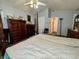 Bright bedroom featuring a four-poster bed and wood furniture at 5451 Kelvington Ln, Indianapolis, IN 46254