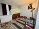 Bedroom with eclectic furnishings, throw pillows and area rug at 5451 Kelvington Ln, Indianapolis, IN 46254