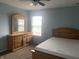 Bedroom featuring carpet, simple window treatments, and a light wood bedroom set at 5801 Safari Dr, Indianapolis, IN 46237