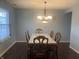 Dining room area with a table and chairs at 5801 Safari Dr, Indianapolis, IN 46237