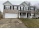 Two story home with a two car garage and front porch at 5801 Safari Dr, Indianapolis, IN 46237
