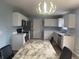 Kitchen featuring white cabinets and a eat-in table at 5801 Safari Dr, Indianapolis, IN 46237
