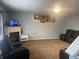Large living room showcasing a fireplace and dark leather furniture at 5801 Safari Dr, Indianapolis, IN 46237