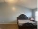 Bedroom featuring carpet and a queen bed with unique headboard at 5801 Safari Dr, Indianapolis, IN 46237
