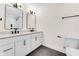 Elegant bathroom featuring double sinks, modern fixtures, and a separate toilet area at 5862 Harbour Town Dr, Noblesville, IN 46062