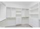 Walk-in closet with custom built-in shelving and drawers for optimal storage and organization at 5862 Harbour Town Dr, Noblesville, IN 46062
