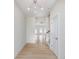 Inviting entryway featuring sleek floors, a white door, and a staircase leading to the upper level of the home at 5862 Harbour Town Dr, Noblesville, IN 46062