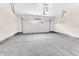 Clean, spacious garage with a concrete floor and a white garage door with windows at 5862 Harbour Town Dr, Noblesville, IN 46062