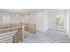 Hallway boasts natural light and access to bedrooms and other living spaces at 5862 Harbour Town Dr, Noblesville, IN 46062