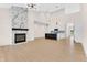 Bright open-concept living space with a modern fireplace and gourmet kitchen at 5862 Harbour Town Dr, Noblesville, IN 46062