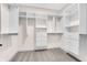 Walk-in closet with custom shelving and drawers for optimal organization and storage at 5862 Harbour Town Dr, Noblesville, IN 46062