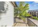Scenic balcony view with a mix of greenery and buildings under a partly cloudy sky at 5874 Harbour Town Dr, Noblesville, IN 46062