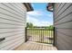 Cozy balcony overlooking a green field with trees under a bright sky at 5874 Harbour Town Dr, Noblesville, IN 46062