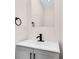 Modern bathroom vanity with a light countertop and black faucet at 5874 Harbour Town Dr, Noblesville, IN 46062