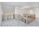 Second story hallway has modern railings, lighting, and neutral colored carpet at 5874 Harbour Town Dr, Noblesville, IN 46062