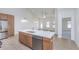 Bright kitchen island featuring stainless steel appliances, a modern design and breakfast bar seating at 5874 Harbour Town Dr, Noblesville, IN 46062