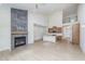 Living room featuring a fireplace with large grey tiles and an open view to the modern kitchen at 5874 Harbour Town Dr, Noblesville, IN 46062