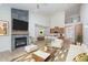 Inviting living room showcasing a fireplace and an open-concept design, seamlessly connecting with the kitchen at 5874 Harbour Town Dr, Noblesville, IN 46062