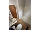A bathroom with a shower-tub combo, sliding doors, ceramic tile and a sink at 6533 Parker Ln, Indianapolis, IN 46220
