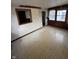 A living space displays tile flooring, natural light, and access to other rooms, though it needs TLC at 6533 Parker Ln, Indianapolis, IN 46220