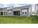 A backyard featuring a screened porch and clean exterior with a well-kept lawn at 7188 Covington St, Lebanon, IN 46052