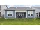 A well-kept backyard features a screened porch and two chairs for relaxing at 7188 Covington St, Lebanon, IN 46052