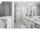 Bathroom features a double vanity with solid surface countertops and an enclosed glass shower at 7188 Covington St, Lebanon, IN 46052