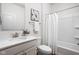Clean bathroom with a white vanity, shower-tub combo, and a neutral color scheme at 7188 Covington St, Lebanon, IN 46052