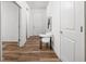 Bright entryway featuring wood flooring, white trim, and a decorative chair at 7188 Covington St, Lebanon, IN 46052