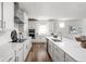 Modern kitchen featuring white cabinetry, stainless steel appliances, and a spacious quartz countertop at 7188 Covington St, Lebanon, IN 46052