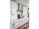 Modern kitchen features white cabinetry, subway tile backsplash, and stainless steel range hood at 7188 Covington St, Lebanon, IN 46052