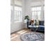 Bright living room features a blue velvet sofa and round accent tables with stylish decor at 7188 Covington St, Lebanon, IN 46052