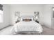 Spacious main bedroom features carpet, a neutral color palette, and tasteful decor at 7188 Covington St, Lebanon, IN 46052