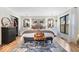 Primary bedroom featuring hardwood floors, a patterned rug, and plenty of natural light at 7643 Dean Rd, Indianapolis, IN 46240
