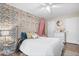 Inviting bedroom with a plush bed, floral wallpaper, and bright lighting at 7643 Dean Rd, Indianapolis, IN 46240