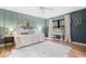 Bedroom with wainscoting, large area rug, and natural light at 7643 Dean Rd, Indianapolis, IN 46240