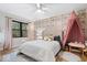 Cozy bedroom with patterned wallpaper and a comfortable bed at 7643 Dean Rd, Indianapolis, IN 46240
