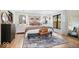 Bright Primary bedroom with hardwood floors, a patterned rug, and plenty of natural light at 7643 Dean Rd, Indianapolis, IN 46240