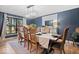 Dining room boasts a large table, elegant chandelier, and ample natural light at 7643 Dean Rd, Indianapolis, IN 46240
