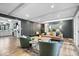 Open living space with hardwood floors, dark walls, and an open floor plan that flows into the kitchen at 7643 Dean Rd, Indianapolis, IN 46240
