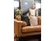 Close up of a leather couch in the living room featuring stylish throw pillows at 7643 Dean Rd, Indianapolis, IN 46240
