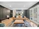 Inviting living room with hardwood floors, dark accent walls, and stylish furnishings complemented by ample natural light at 7643 Dean Rd, Indianapolis, IN 46240