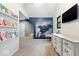 Bright room with playful wall art, built-in bookshelves and modern color scheme at 7643 Dean Rd, Indianapolis, IN 46240